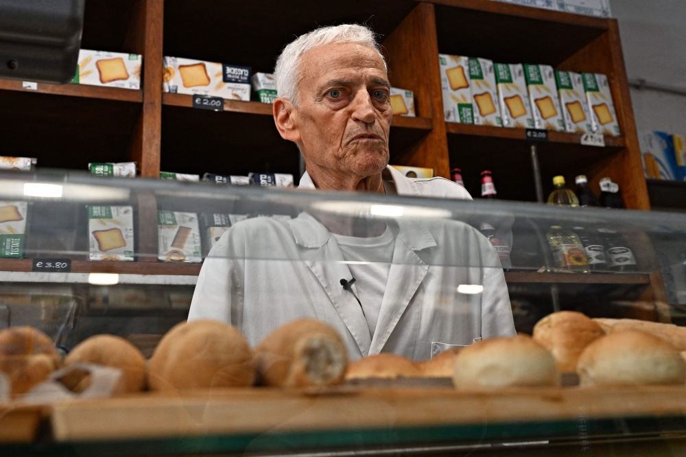 Angelo Arrigoni owner of the historic bakery that has supplied bread to the Pope, which will close in the coming days, looks on during an interview, in the Borgo Pio district, adjacent to the Vatican, in Rome, on July 6, 2023. — AFP pic