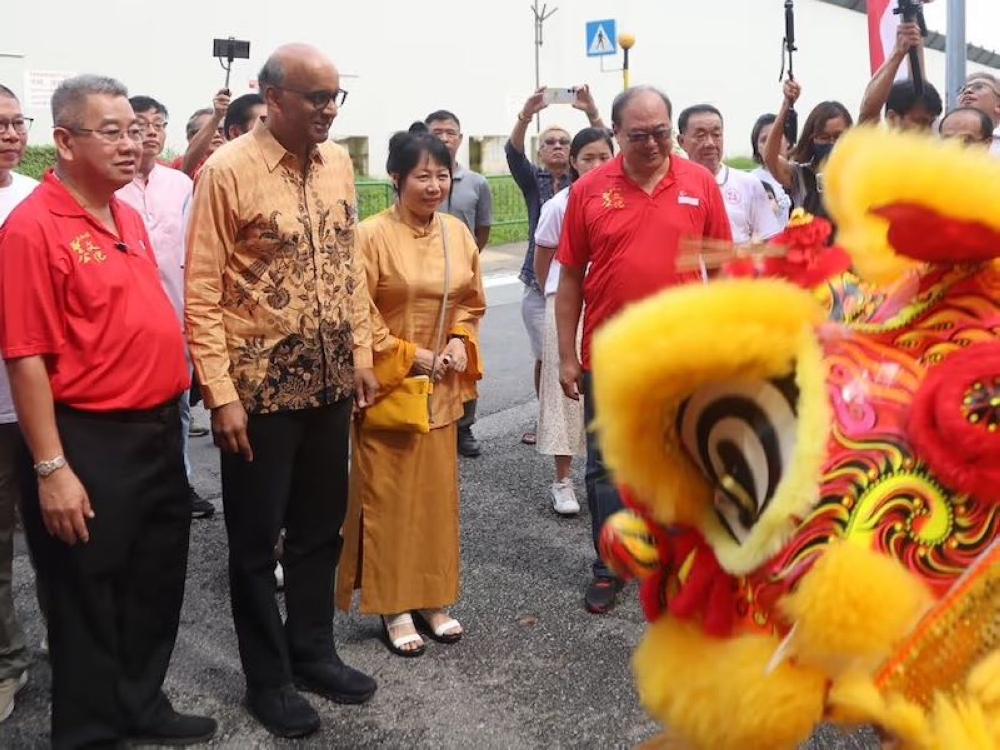 Mr Tharman Shanmugaratnam and his wife, Madam Jane Yumiko Ittogi, at the Sheng Gong Cultural and Folklore Beliefs Festival in Redhill, July 9, 2023. This is his first public event after stepping down from politics. — TODAY pic