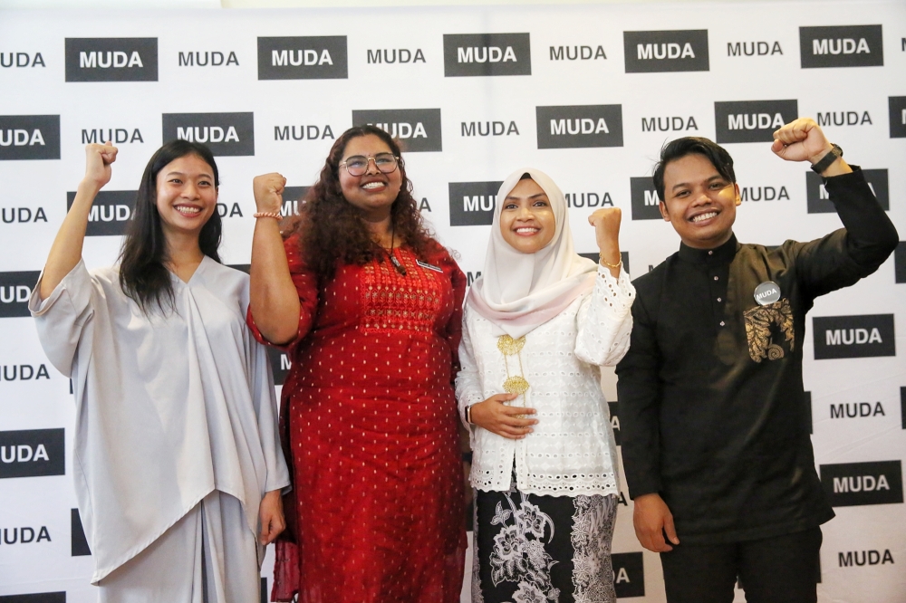 (From left) Muda candidates Melanie Ting Yi-Hlin, R. Thanusha or Teacher Thanusha, Syaidiyah Izzati Nur Razak Maideen or Cheda Razak, and Amir Hariri Abd Hadi at Bilik Gerakan Utama Muda in Petaling Jaya, July 13, 2023. — Picture by Choo Choy May