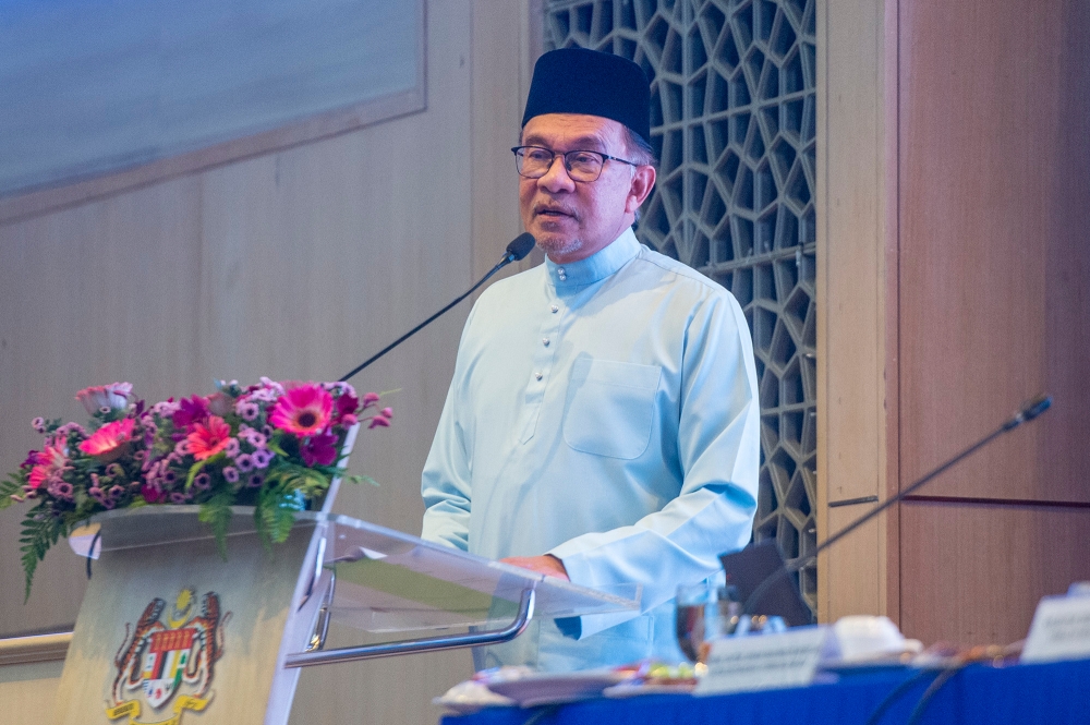 Prime Minister Datuk Seri Anwar Ibrahim delivers his speech during the 2024 Budget engagement at the Finance Ministry in Putrajaya July 14, 2023. — Picture by Shafwan Zaidon 