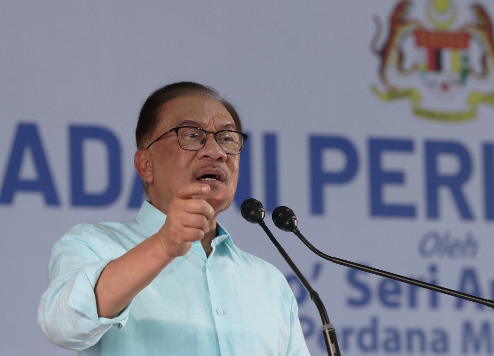 Prime Minister Datuk Seri Anwar Ibrahim speaks at the Kedah-level ‘Sentuhan Madani’ (Madani Touch) programme with farmers, breeders, fishermen, rubber tappers and smallholders at the Mada headquarters in Alor Setar July 15, 2023. ― Bernama pic