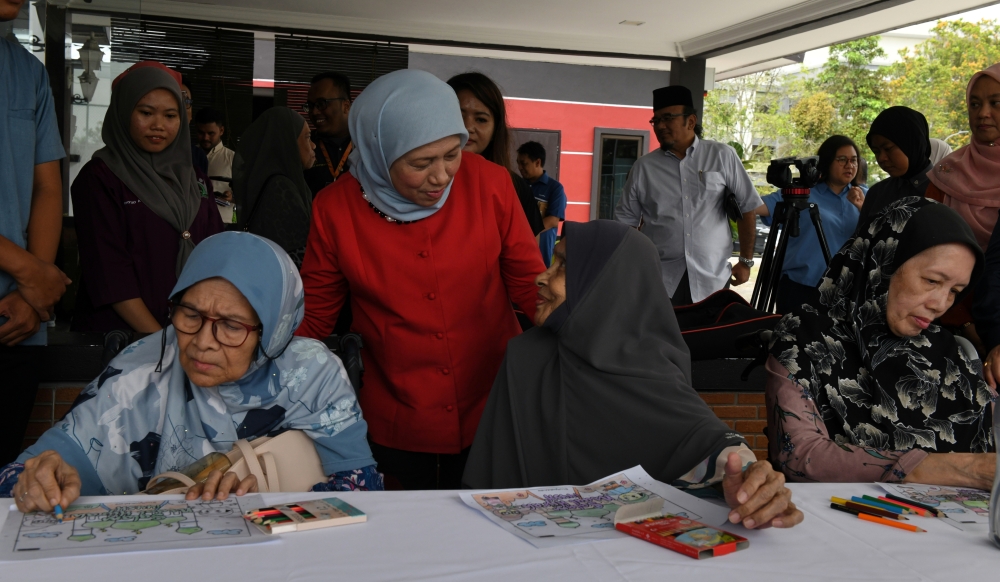 Women, Family and Community Development Minister Datuk Seri Nancy Shukri talks to residents of the Damai Permai Care Centre in Kepala Batas, July 17, 2023. — Bernama pic 