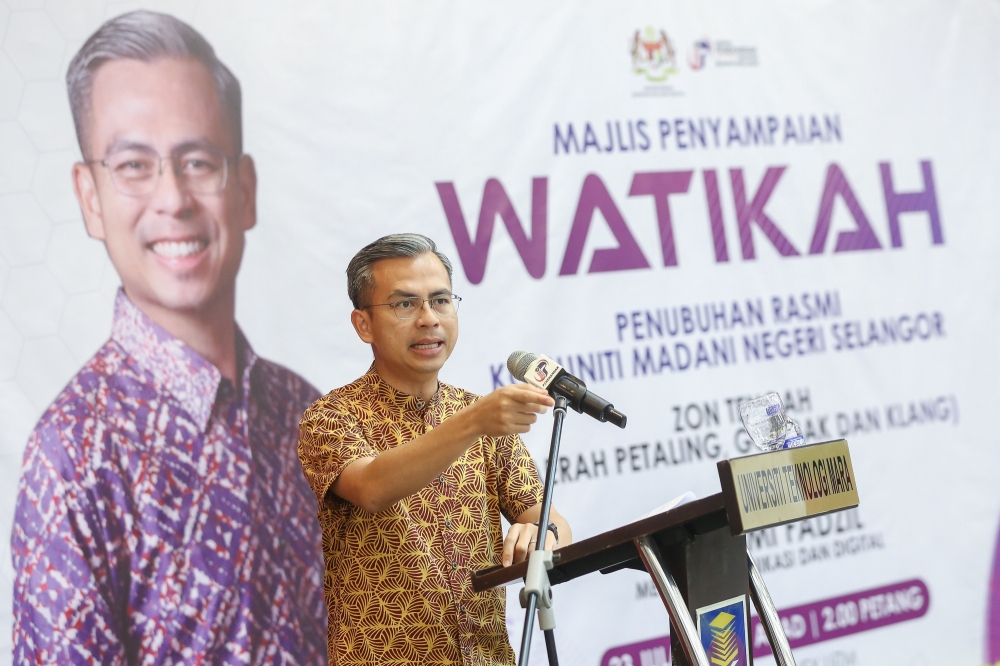 Communications and Digital Minister Fahmi Fadzil delivers his speech during the Selangor Central Zone 2023 Madani Community handover ceremony at Universiti Teknologi Mara (UiTM) in Shah Alam July 23, 2023. — Picture by Yusof Mat Isa