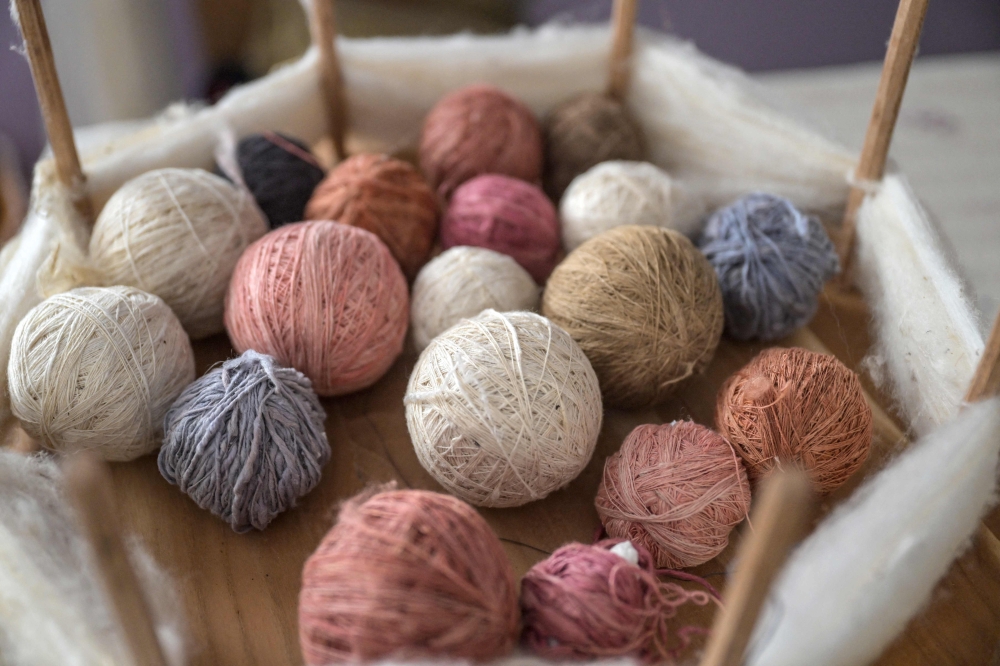 This photograph taken on July 10, 2023 in Antakya shows silk thread balls in different colours. — AFP pic