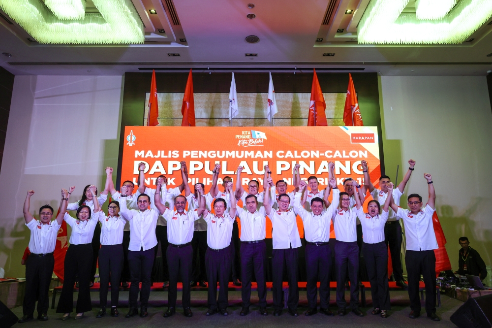 DAP secretary-general Anthony Loke with party candidates for the Kedah and Penang state polls, in George Town, July 25, 2023. — Bernama pic