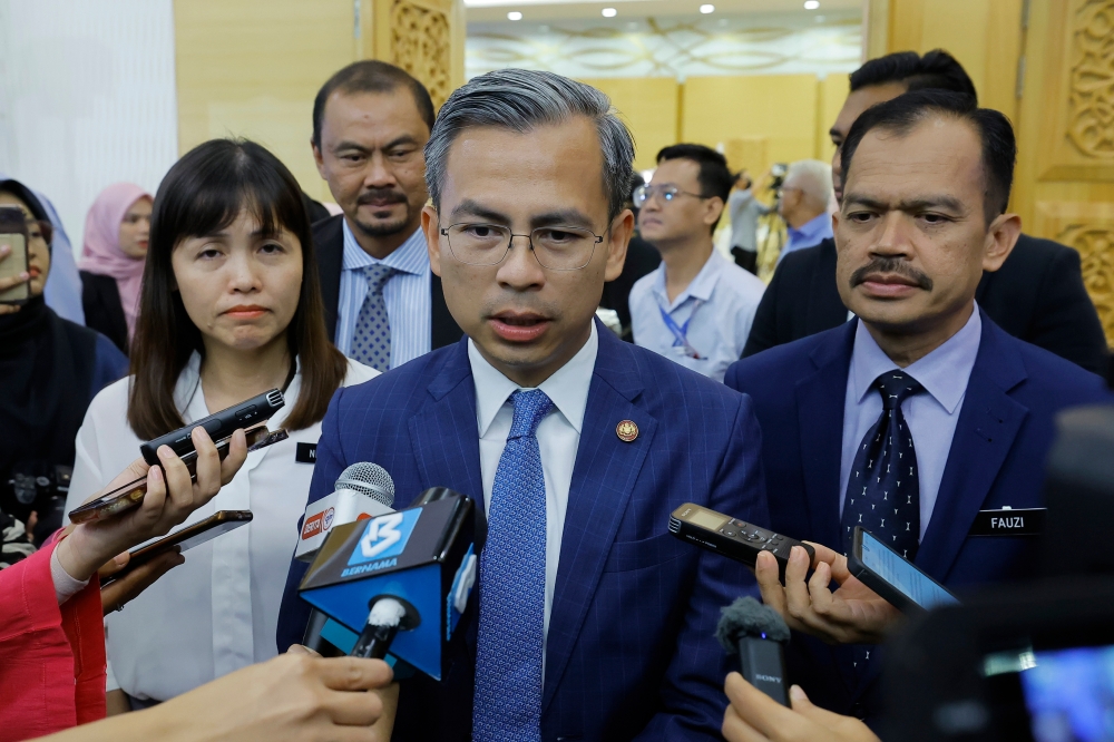 Communications and Digital Minister Fahmi Fadzil speaks to reporters after the ministry’s monthly assembly in Putrajaya July 31, 2023. — Bernama pic