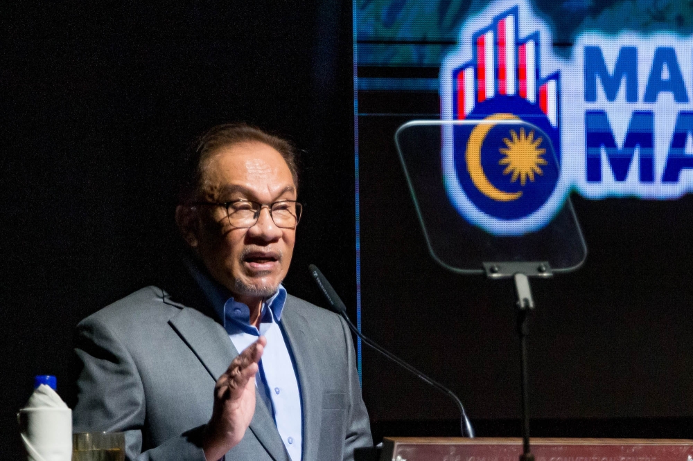 Prime Minister Datuk Seri Anwar Ibrahim speaks at the National Tax Conference 2023 at Kuala Lumpur Convention Centre in Kuala Lumpur August 1, 2023. — Picture by Firdaus Latif