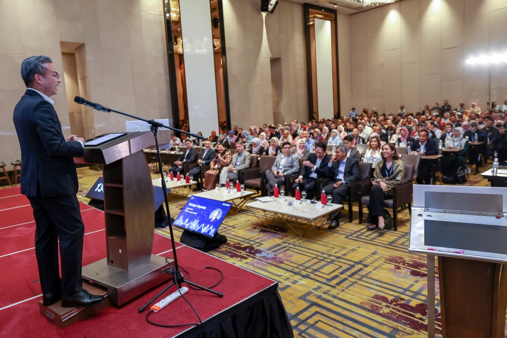 Communications and Digital Minister Fahmi Fadzil delivers his keynote address at the Public Sector Day Malaysia programme in PUtrajaya August 1, 2023. — Bernama pic