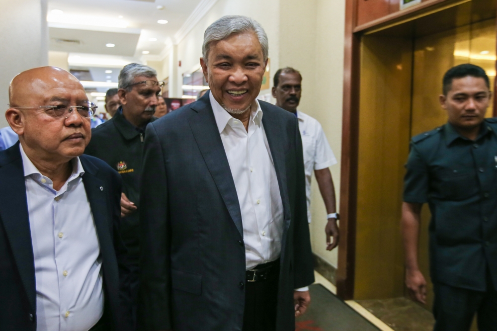 Deputy Prime Minister Datuk Seri Ahmad Zahid Hamidi (centre) is facing 47 charges in this trial. —Ahmad Zamzahuri