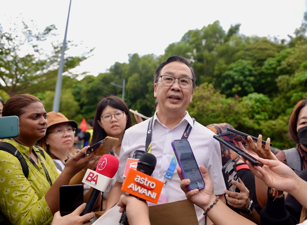 Gerakan president Datuk Dominic Lau reportedly said that PAS president Tan Sri Abdul Hadi Awang had asked to meet at 9pm before the start of the event, but said the latter had ran late and was present at around 10.30pm. — Picture by KE Ooi