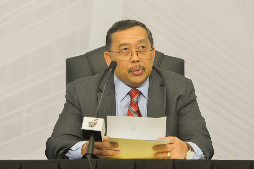 EC chairman Tan Sri Abdul Ghani Salleh speaks during a press conference in Putrajaya August 3, 2023. ― Picture by Miera Zulyana