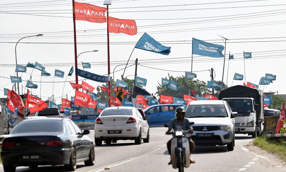 Flags of political parties can be seen at N.49 Sungai Kandis in Shah Alam, August 3, 2023. — Bernama pic