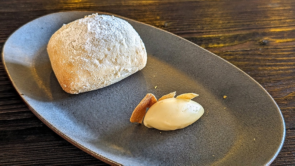 A fresh, hot, soft ciabatta with an equally soft, whipped quenelle of garlic lemon butter.