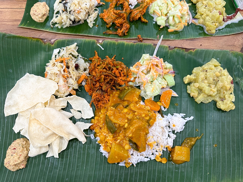 Your banana leaf rice is served with four types of vegetables, 'pappadum' and chutney