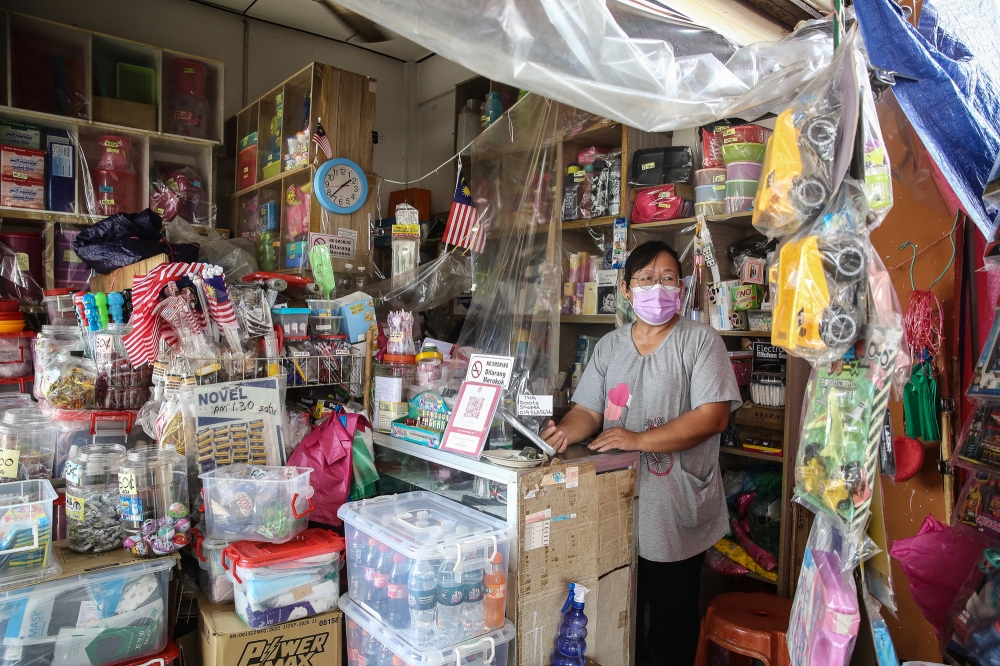 Business owner Mooi waiting for her customer at her shop in Jeniang, Kedah, August 8, 2023. — Picture by Yusof Mat Isa