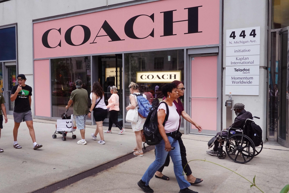Coach owner's Michael Kors deal creates US giant to take on