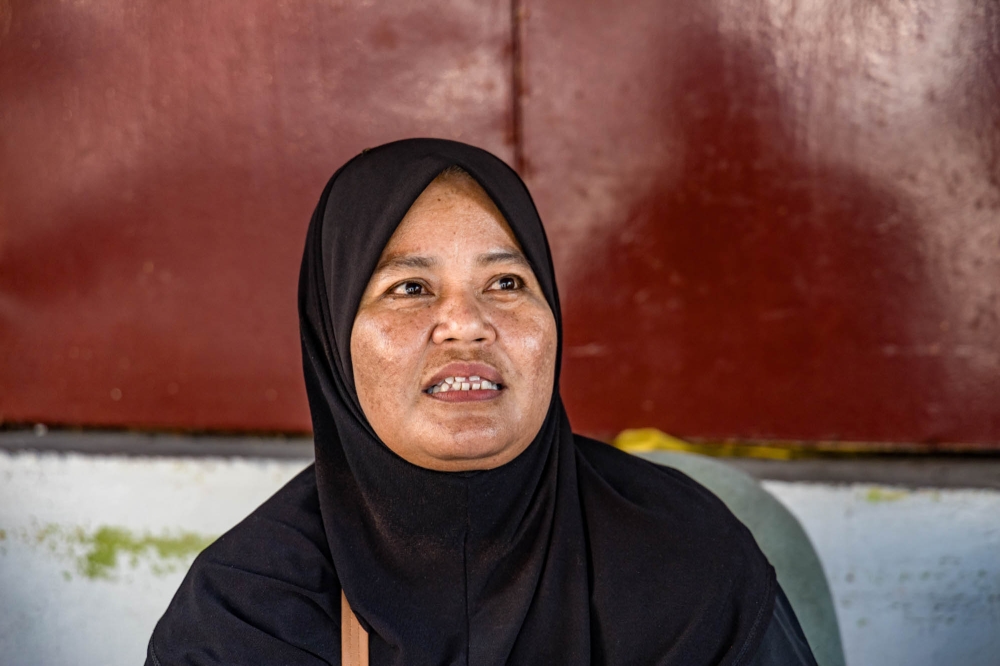 Aini Talib, 50, said there were supporters of both camps in the flats in Keramat. — Picture by Firdaus Latif   