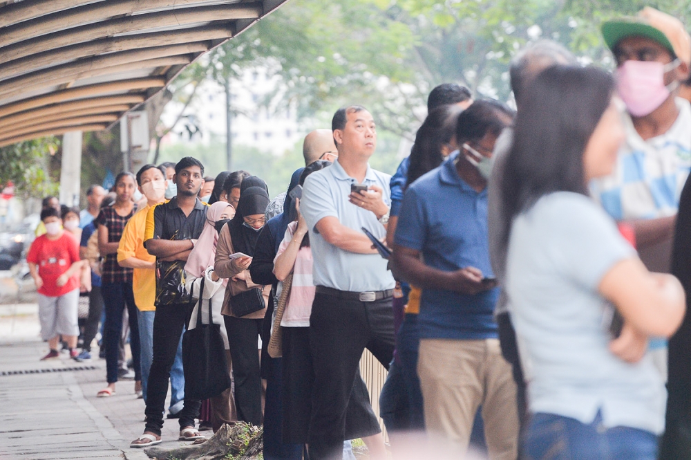 Voters queue up to cast their ballots at a polling centre in Puchong August 12, 2023. ― Picture by Miera Zulyana