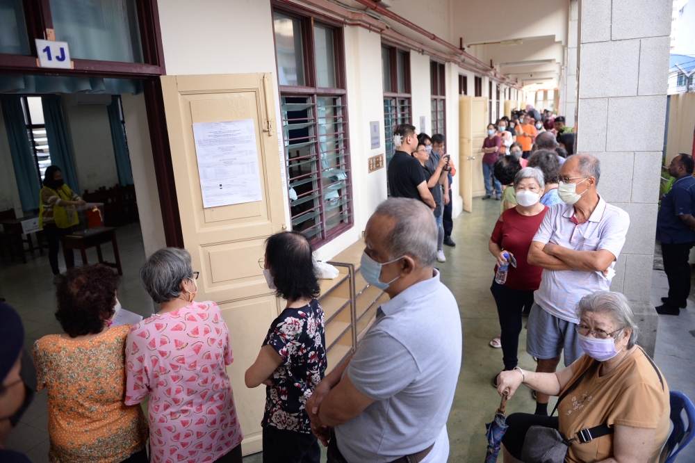 Voters queue up to cast their ballots at a polling centre in George Town August 12, 2023. ― Picture by KE Ooi