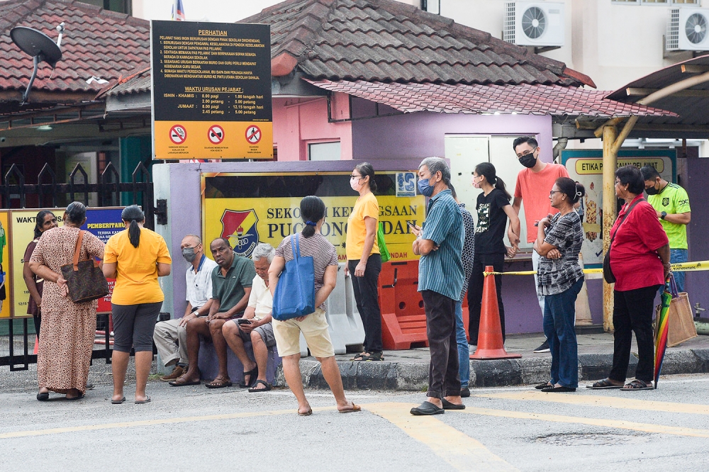 Voters queue up to cast their ballots at a polling centre in Puchong August 12, 2023. ― Picture by Miera Zulyana