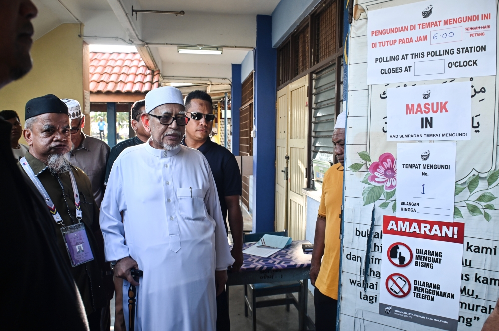 PAS president Tan Sri Abdul Hadi Awang arrives to cast his ballot at at Sekolah Kebangsan Rusila in Marang August 12, 2023. ― Bernama pic