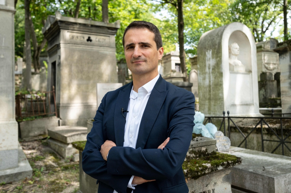 The curator of the Pere Lachaise cemetery Benoit Gallot poses for a photograph at the Pere Lachaise cemetery in Paris August 8, 2023.  — AFP pic