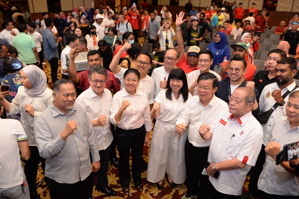 Penang DAP Chairman Chow Kon Yeow (2nd right) together with other DAP candidates and members at the PH-PN result centre August 12, 2023. — Picture by KE Ooi