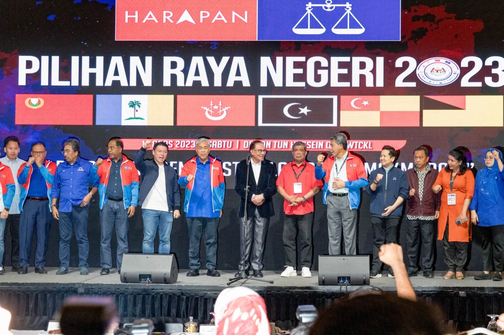 Prime Minister and Pakatan Harapan chairman Datuk Seri Anwar Ibrahim (centre) with other leaders of his coalition during Unity Government Secretariat results viewing at World Trade Centre in Kuala Lumpur August 12, 2023. — Picture by Firdaus Latif