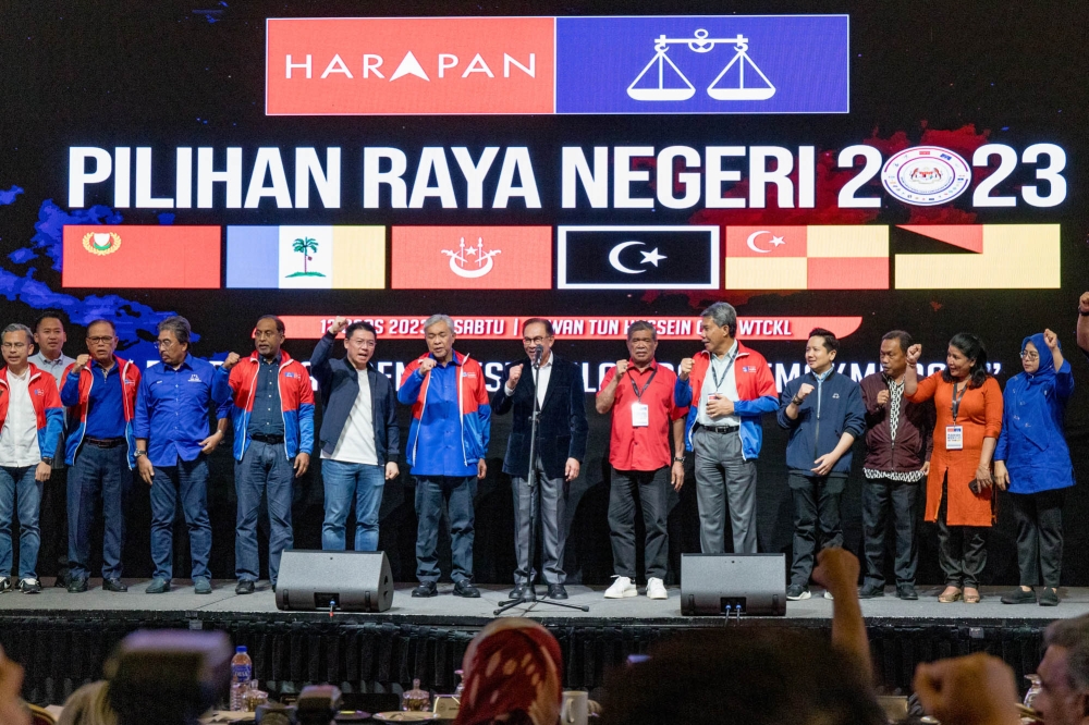 Prime Minister and Pakatan Harapan chairman Datuk Seri Anwar Ibrahim with other leaders of his coalition during the unity government secretariat results viewing at World Trade Centre in Kuala Lumpur, August 12, 2023. — Picture by Firdaus Latif