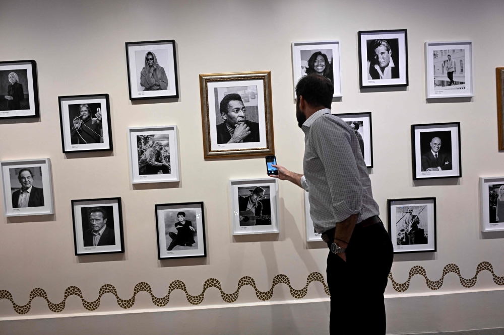 A man gets information using a QR code at the Hall of Fame of the Belmond Copacabana Palace Hotel. — AFP pic