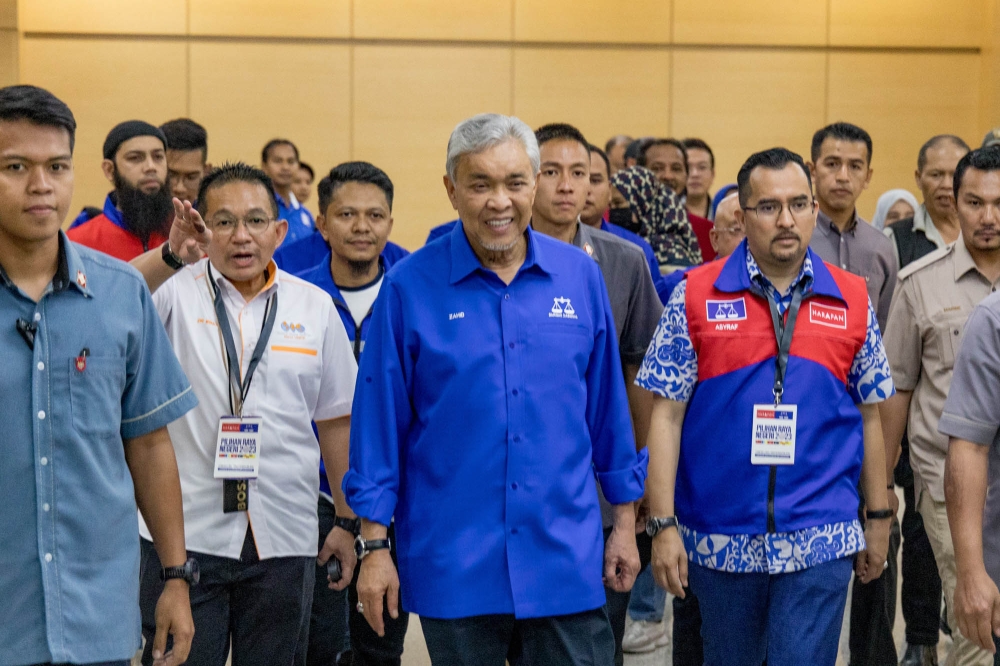 Analysts said calls for Datuk Seri Ahmad Zahid Hamidi to resign as the Umno president was fair, given that his predecessor, Datuk Seri Najib Razak, did so after leading the party and BN to defeat in the 2018 general election. — Picture by Firdaus Latif