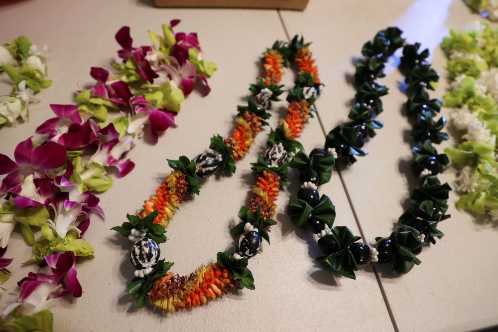 Different types of lei are displayed on a table at Maui Floral in Makawao, Hawaii August 18, 2023.