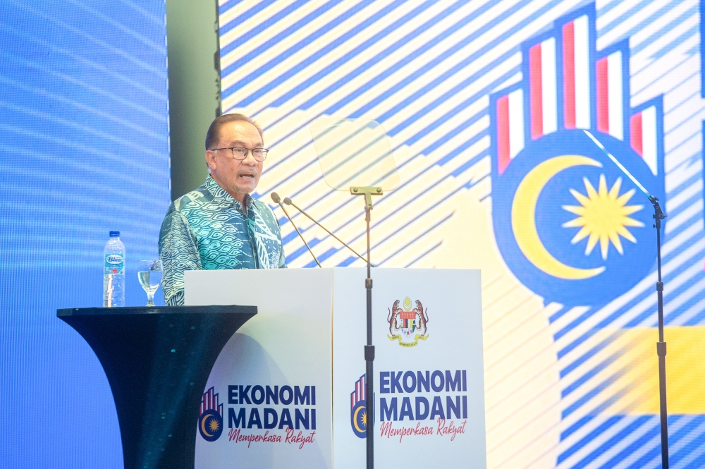 Prime Minister Datuk Seri Anwar Ibrahim delivers his speech during the launch of ‘Madani Economy Empowering the People’ framework at Securities Commission in Kuala Lumpur July 27, 2023. — Picture by Shafwan Zaidon