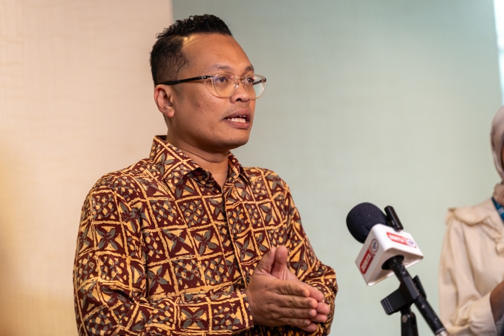 Minister of Natural Resources, Environment and Climate Change, Nik Nazmi Nik Ahmad delivering his keynote address during the 12th Indigenous Land Conference at Armada Hotel, Petaling Jaya, August 26, 2023. — Picture By Raymond Manuel