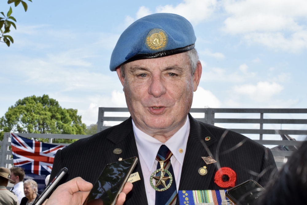 Major Paul Rosenzweig (retired) speaking to reporters after the ceremony. — Borneo Post pic 