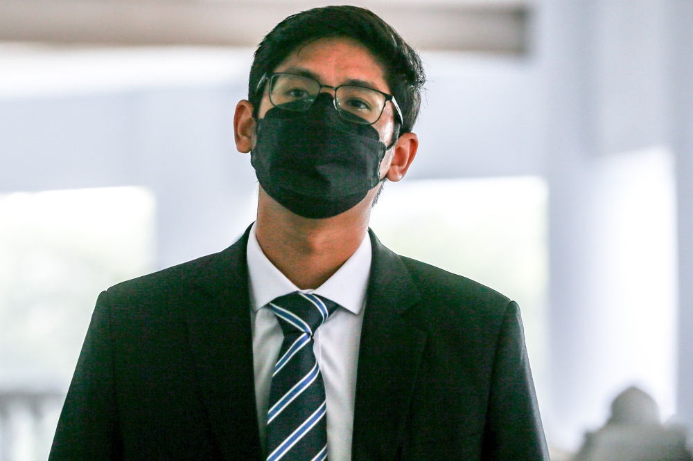 Bank Negara Malaysia Analyst, Adam Ariff Mohd Roslan arrives at the Kuala Lumpur High Court Complex August 30, 2023. — Picture by Hari Anggara