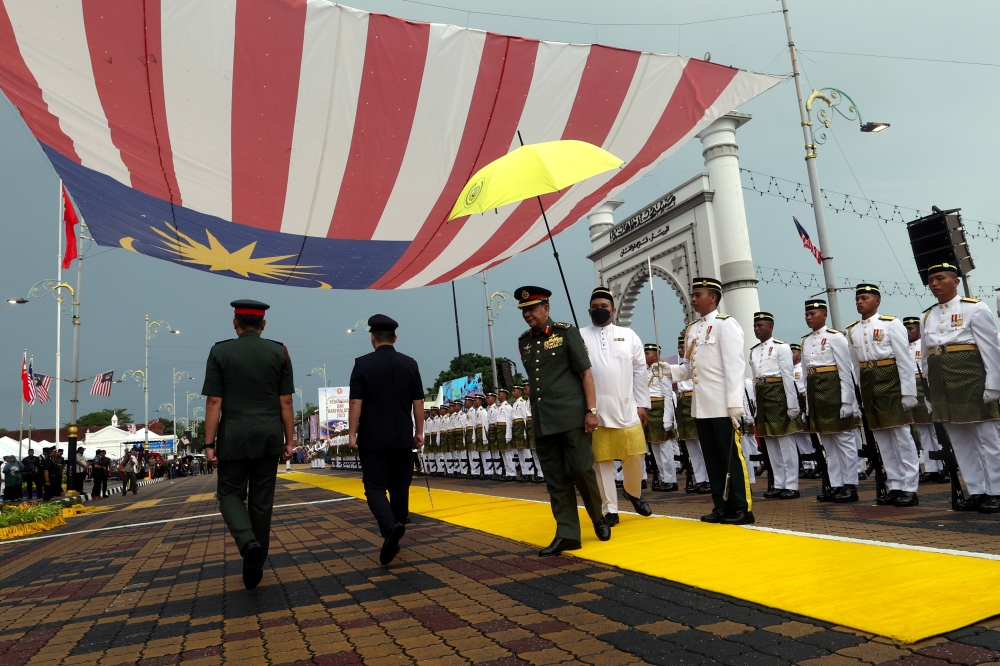 Sultan Kedah Al-Aminul Karim Sultan Sallehuddin Sultan Badlishah inspects the guard of honour during the 66th National Day Celebration at Dataran Medan Bandar Alor Setar in Alor Setar, August 31, 2023. — Bernama pic 