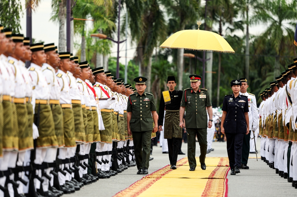 Sultan of Perak, Sultan Nazrin Shah, inspects the guard of honour at the grounds of Stadium Indera Mulia. — Bernama pic 