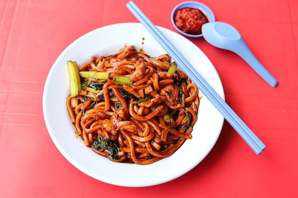 The Hokkien mee is slick with the shiny dark sauce.