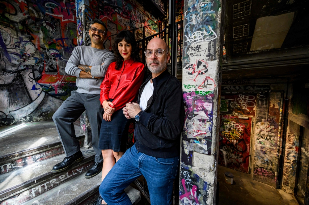 Chairman of the Board and majority shareholder in Fotografiska Holding AB Yoram Roth (right), director of Fotografiska Berlin Yousef Hammoudah (left), and director of exhibitions Marina Paulenka (centre) pose in the stairwell of the new Fotografiska museum, located in the former Tacheles building in Berlin August 31, 2023. — AFP pic