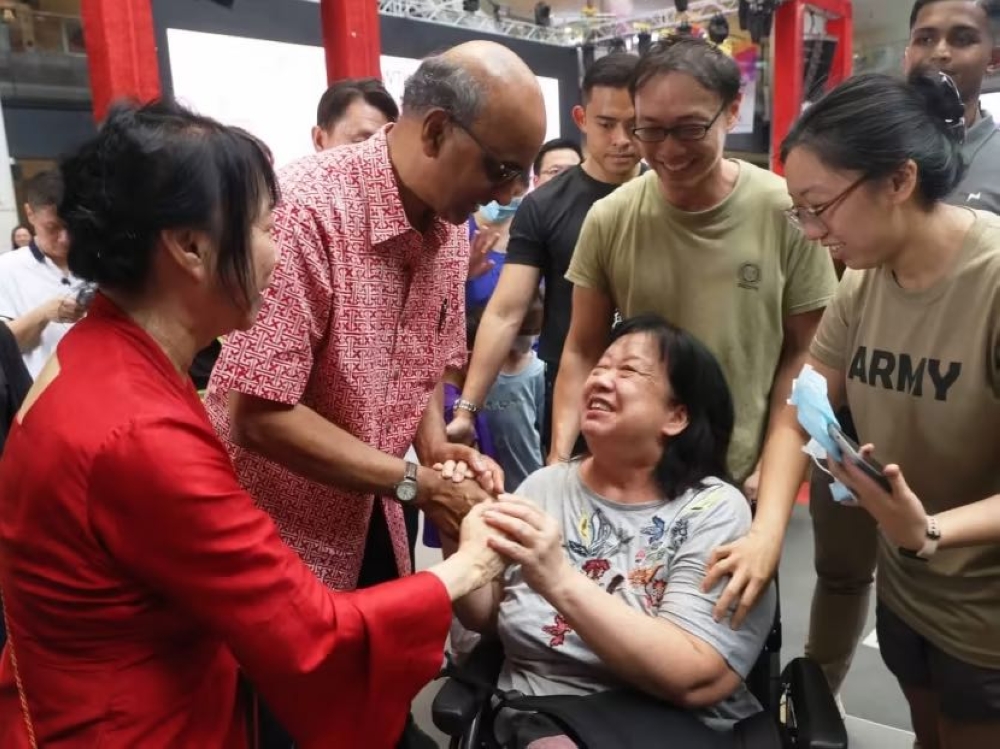 Mr Tharman Shanmugaratnam and his wife Jane Ittogi (left) meeting supporters at Our Tampines Hub on September 2, 2023. — TODAY pic