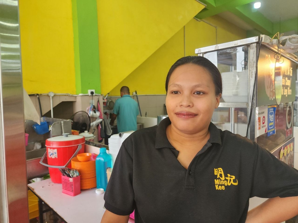 Irene Salia, a 27-year-old rice dish seller from Kota Samarahan. ― Borneo Post pic