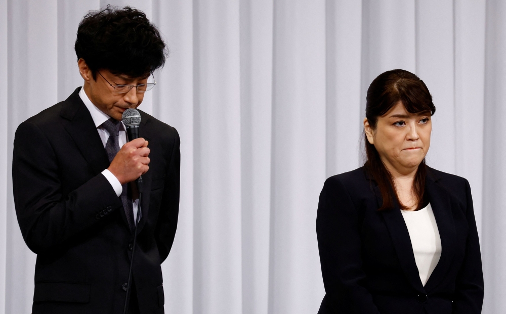 Japan’s talent agency Johnny & Associates former president Julie Fujishima and new president Noriyuki Higashiyama attend a press conference in Tokyo. — Reuters pic