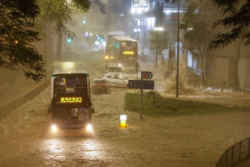 Record rainfall in Hong Kong caused widespread flooding in the early hours of Friday, disrupting road and rail traffic just days after the city dodged major damage from a super typhoon. — Reuters pic