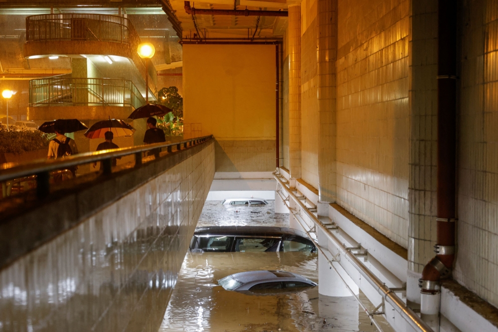 A flooded parking lot in Hong Kong. — Reuters pic