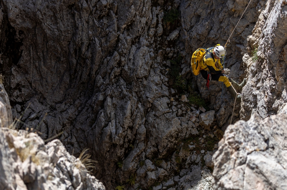 A rescuer descends to the entrance of Morca Cave as he takes part in a rescue operation to reach US caver Mark Dickey who fell ill and became trapped some 1,000 metres underground, near Anamur in Mersin province, southern Turkey September 8, 2023. — Reuters pic