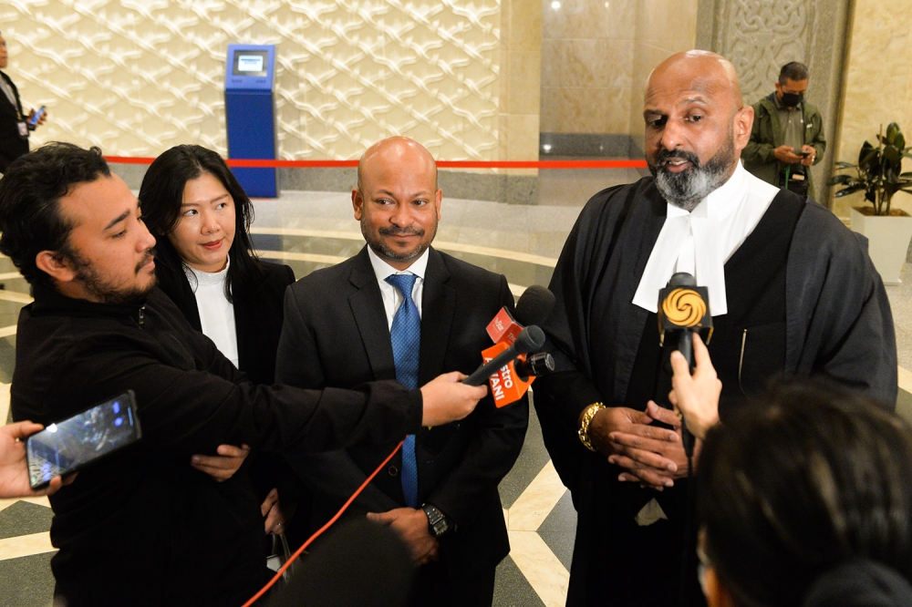 Lawyers Datuk N. Sivananthan and Jasmine Cheong speak to reporters in Putrajaya September 12, 2023. ― Picture by Miera Zulyana