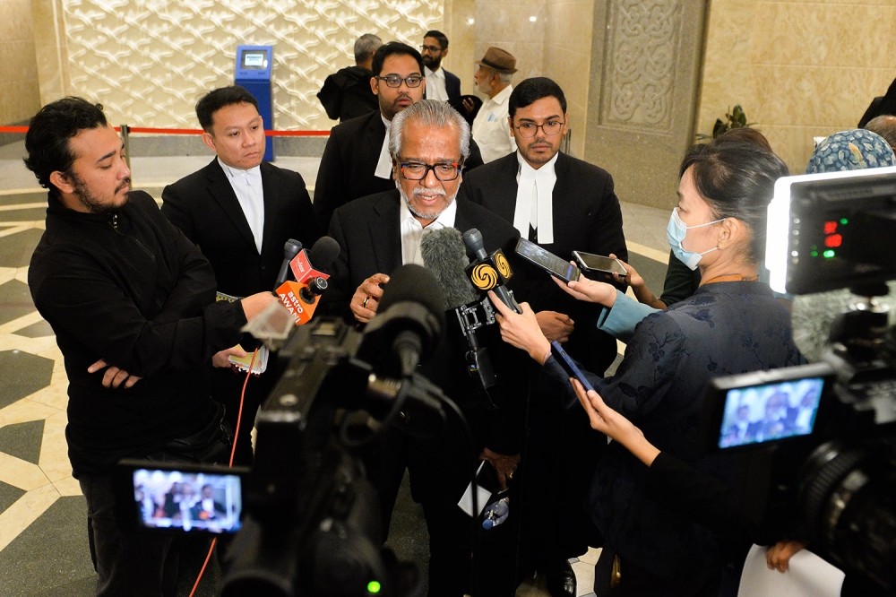 Lawyer Tan Sri Muhammad Shafee Abdullah speaks to reporters in Putrajaya September 12, 2023. ― Picture by Miera Zulyana