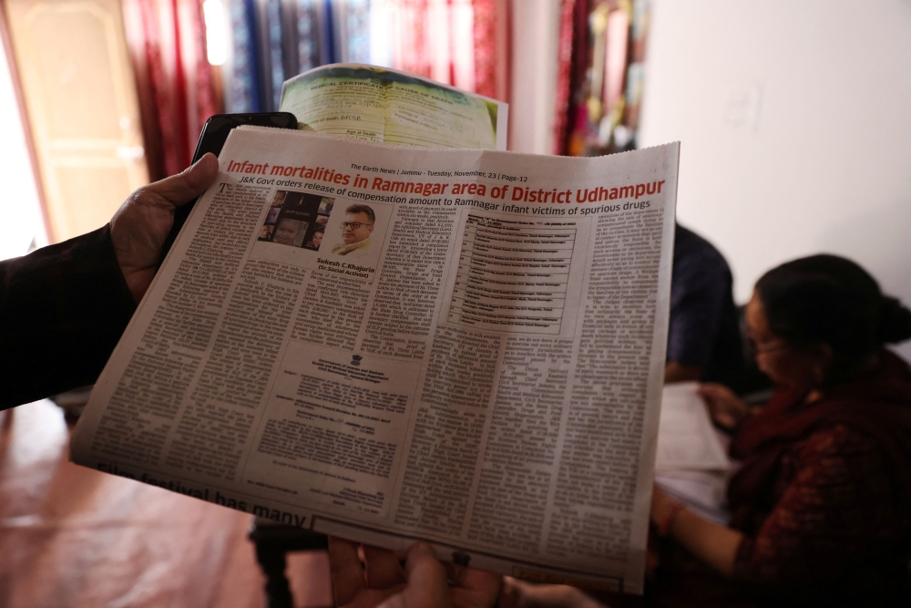 A newspaper article depicting children's deaths after consuming contaminated cough syrup and activist Sukesh Khajuria is seen at Ashok Kumar's house in Ramnagar on the outskirts of Jammu March 28, 2023. — Reuters pic