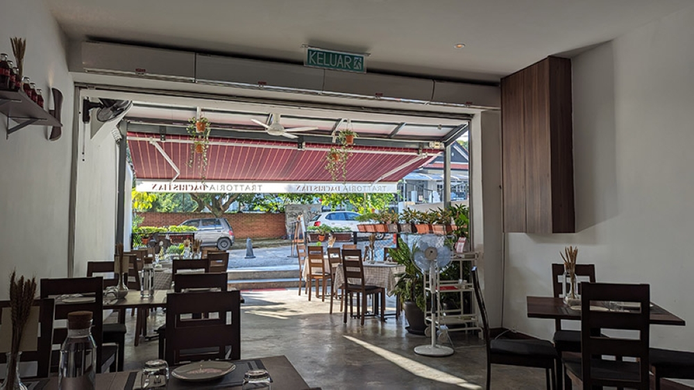 The interior at Trattoria Dacristian. The awning out front makes for a shaded, yet outdoor setting to dine in.